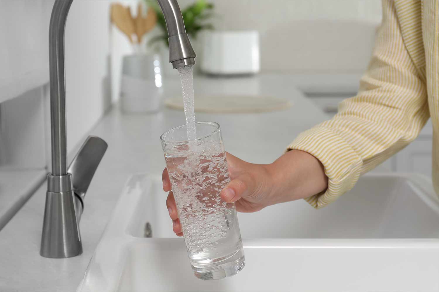 Filling a glass of water in a London, Ontario home